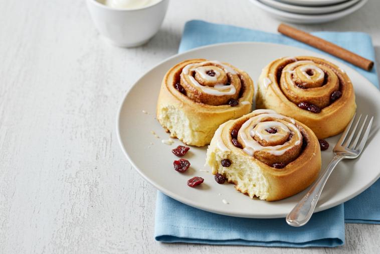 Delicious Cinnamon Rolls topped with icing cream